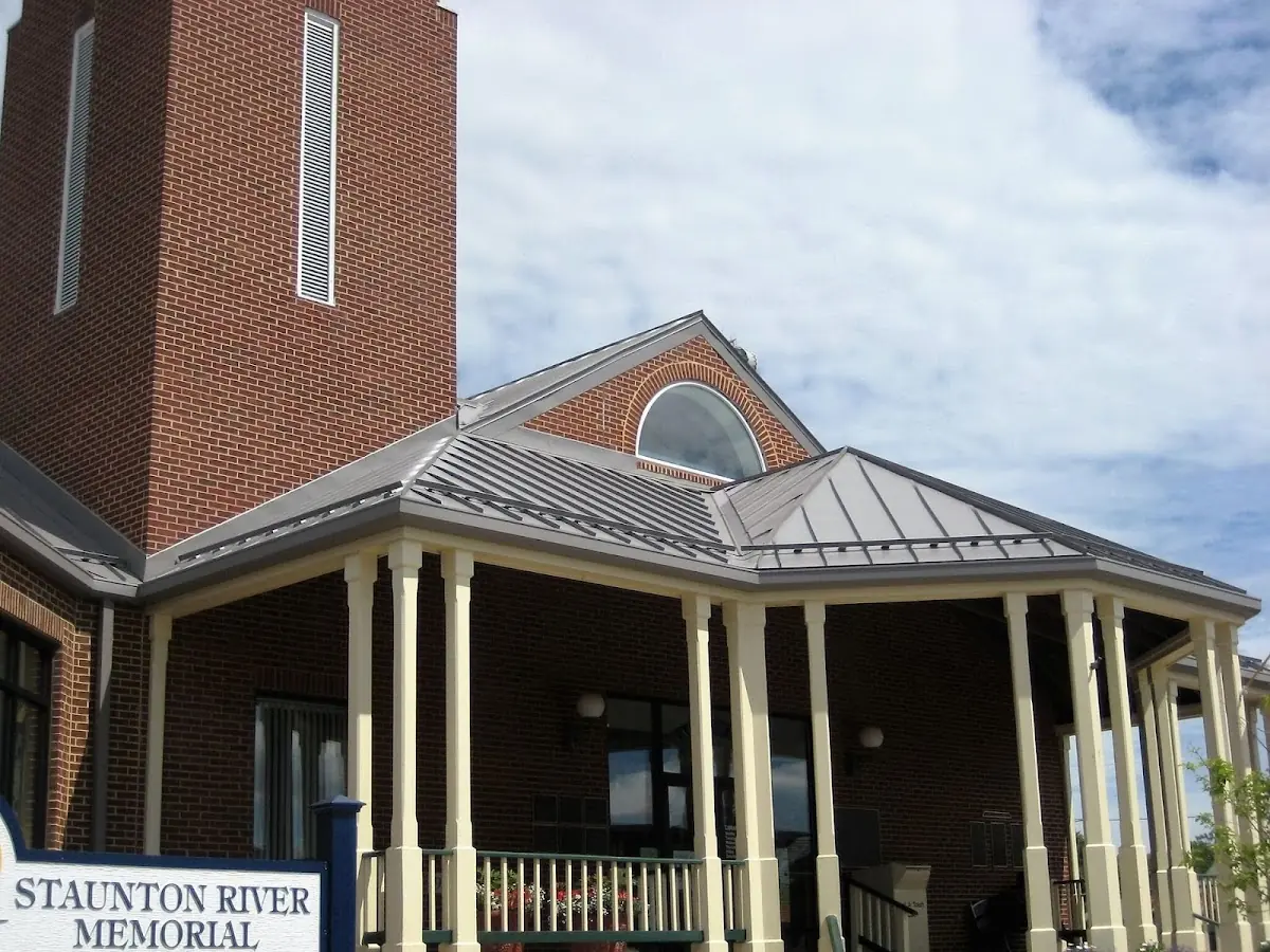 Skilled roofing craftsmen working on a residential roof in Hunt Meadows
